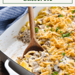 Front shot of a hamburger stroganoff casserole with a text title box at the top