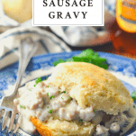 Sausage gravy on a buttermilk biscuit with text title box at top