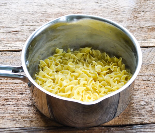 Cooked egg noodles in a saucepan
