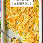 Overhead shot of chicken noodle casserole in a vintage baking dish with text title box at the top