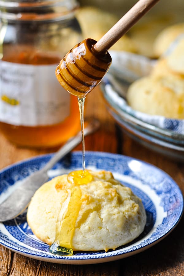 Drizzling honey on a drop biscuit