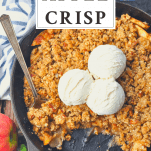Close overhead shot of apple crisp in a skillet with text title box at top
