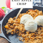 Close up shot of easy apple crisp in a cast iron skillet with text title at top