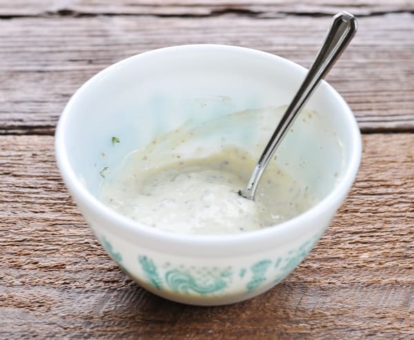 Homemade tartar sauce in bowl with spoon