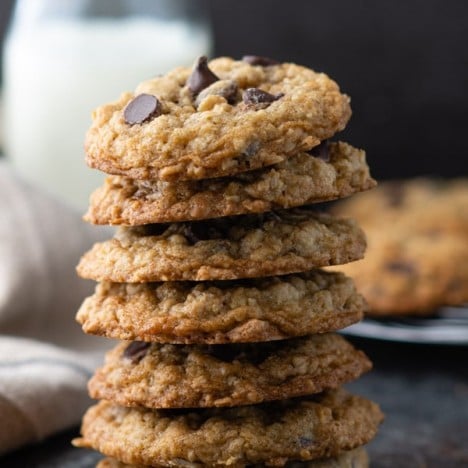 Close up shot of a stack of old-fashioned soft and chewy oatmeal chocolate chip cookies