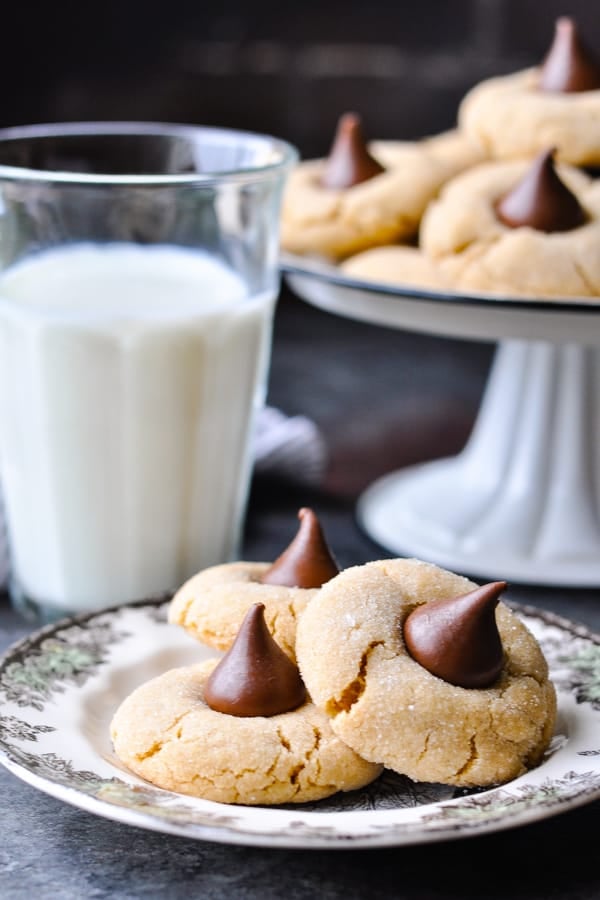 Three peanut butter blossoms on a small plate