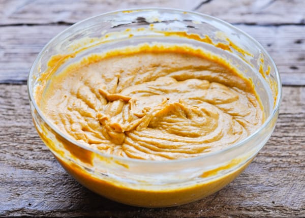 Pumpkin dip in a large glass mixing bowl