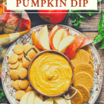 Overhead shot of a tray of pumpkin dip with apples and cookies and text title at the top