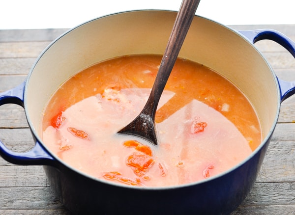 Stirring together a pot of tomato basil soup