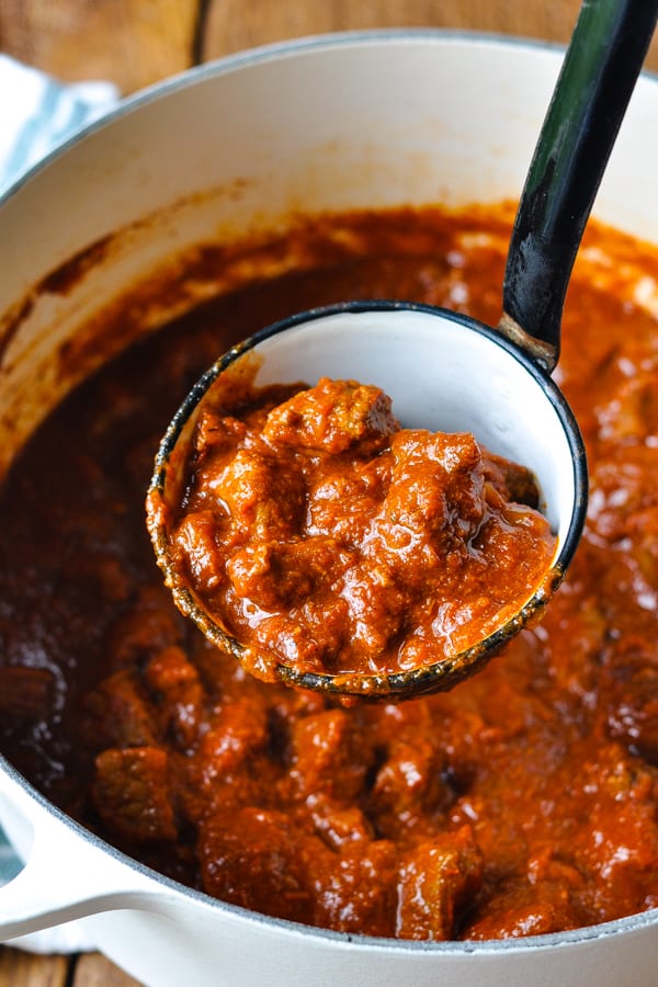 Close overhead image of a ladle scooping up texas chili con carne