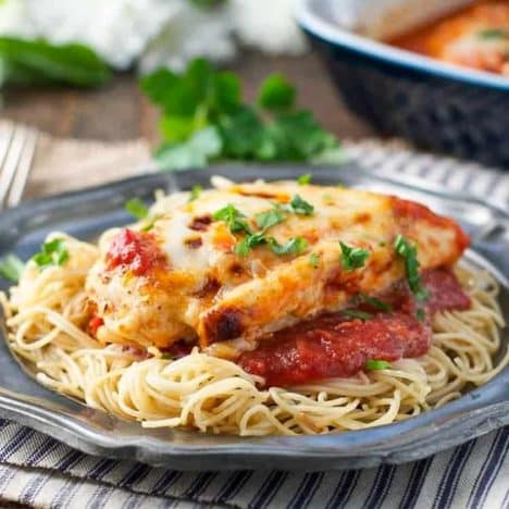 Square side shot of healthy chicken parmesan on a plate with pasta