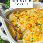 Spoon in a pan of Amish Chicken Casserole with corn and a text title box at the top