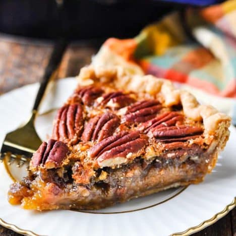 Slice of the best easy pecan pie recipe on a plate.
