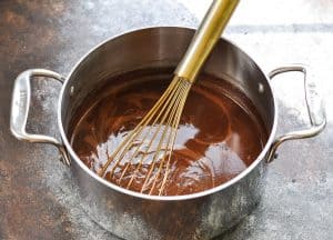 Boiling chocolate mixture for Texas Sheet Cake