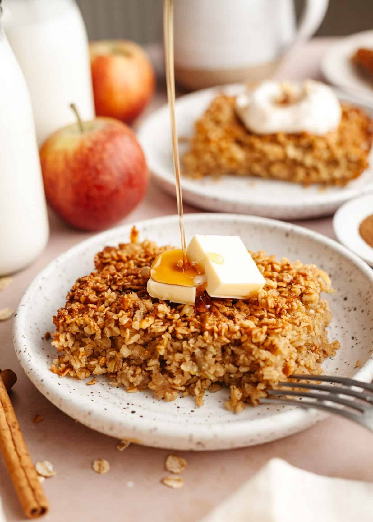 Drizzling maple syrup on a slice of Amish baked apple oatmeal.
