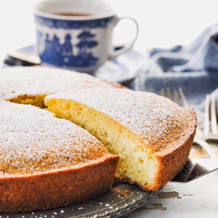 Square close up side shot of a slice of the best French breakfast cake recipe on a spatula.