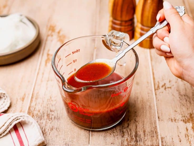 Process shot showing how to make the sauce for Crock Pot smothered pork chops.