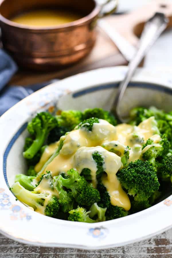 Velveeta broccoli and cheese in a bowl with a serving spoon