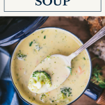 Broccoli and cheese soup in a pot with text title box at top