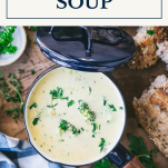 Bowl of broccoli cheese soup with text title box at top
