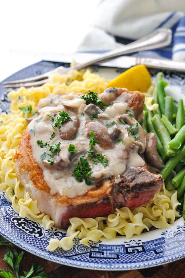Large pork chop smothered in a creamy mushroom sauce