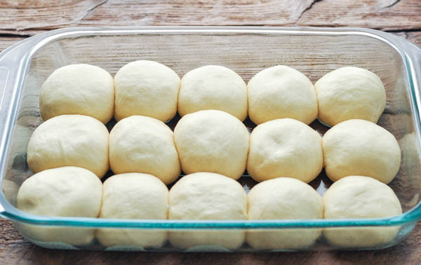 Process shot showing how to make dinner rolls