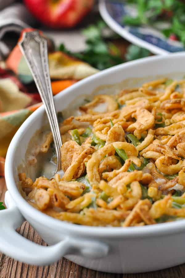 Close up front shot of an easy green bean casserole in a white dish