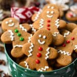 Soft gingerbread man cookies in a cookie tin with fun decorations and icing