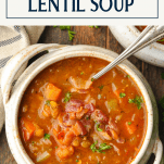 Overhead shot of a bowl of lentil soup with a text title box at the top