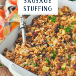 Front shot of sausage stuffing in a white casserole dish with a text title box at the top