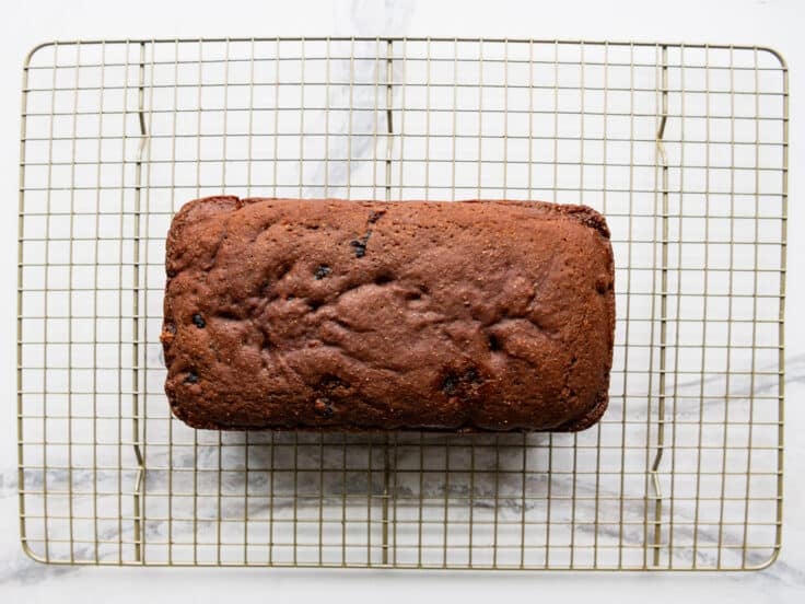 Boston brown bread recipe cooling on a wire rack.