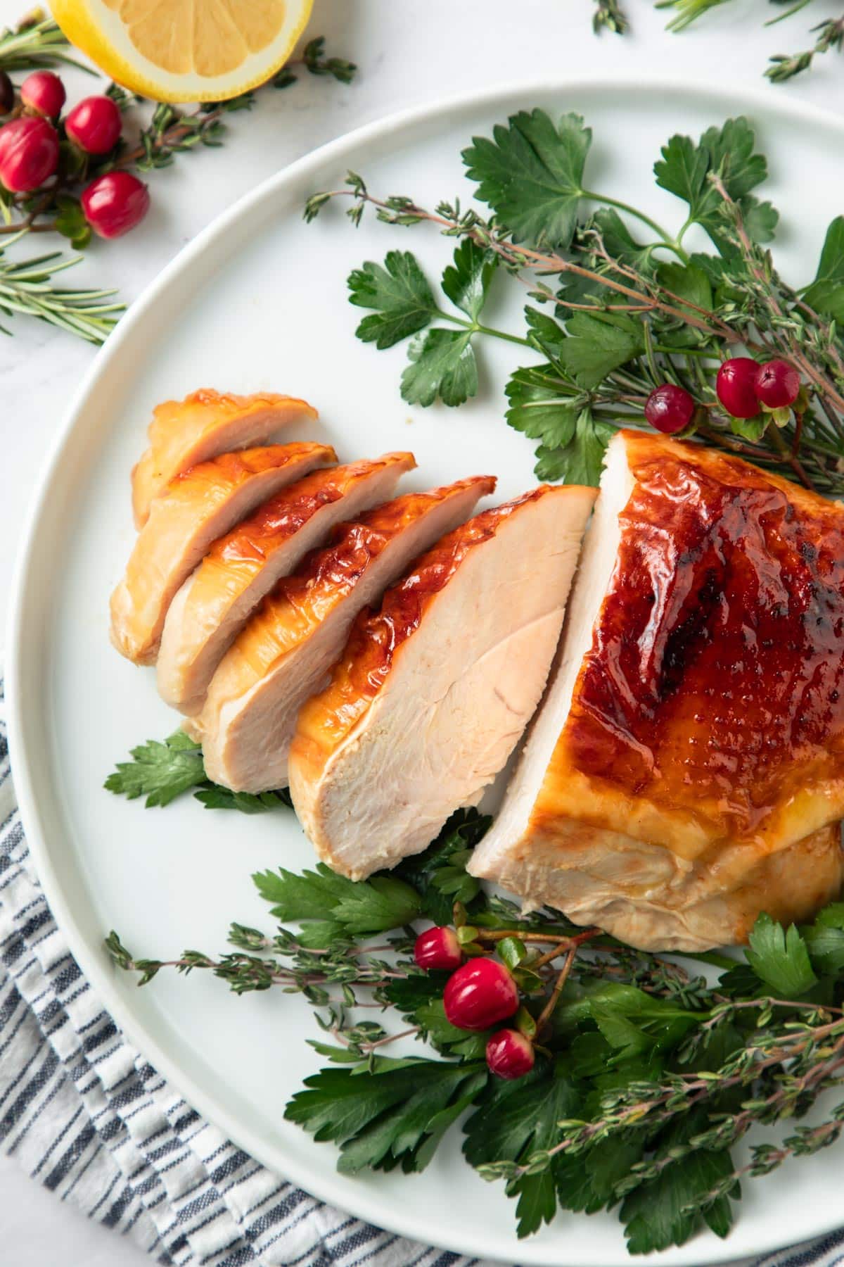 Overhead shot of sliced roasted turkey breast on a serving platter.