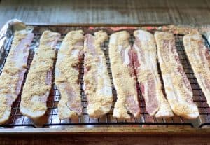 Process shot showing how to make candied bacon