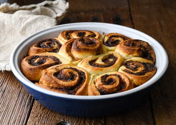 Easy cinnamon roll recipe baked in a round pan before frosting