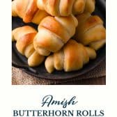 Homemade crescent rolls (Amish butterhorn rolls) with text title at the bottom.