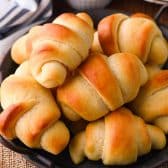 Close up square shot of a platter of crescent rolls (Amish butterhorn rolls).
