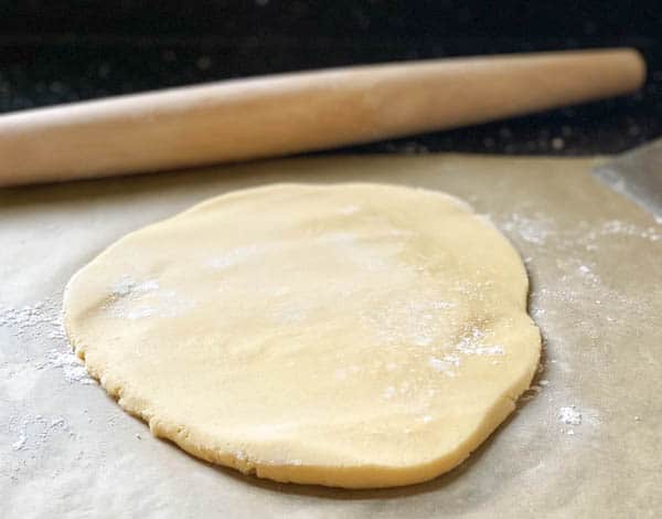 Rolling out homemade sugar cookie dough