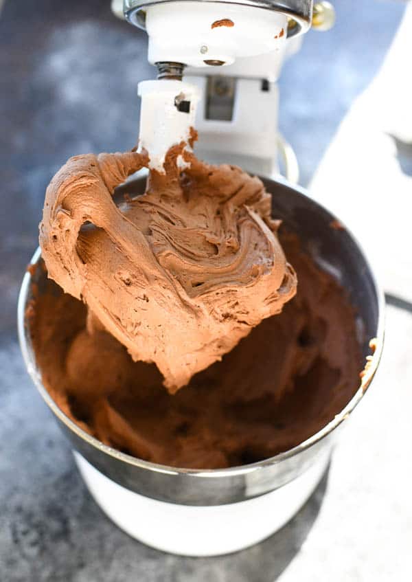 Process shot showing how to make chocolate frosting for cake