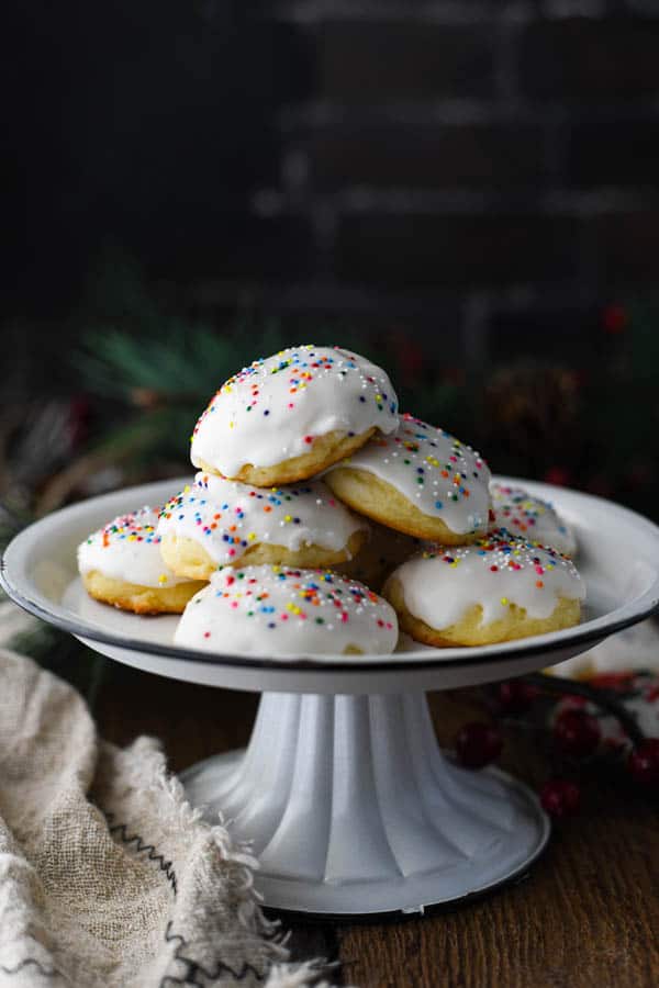 Front shot of ricotta christmas cookies on a white serving tray