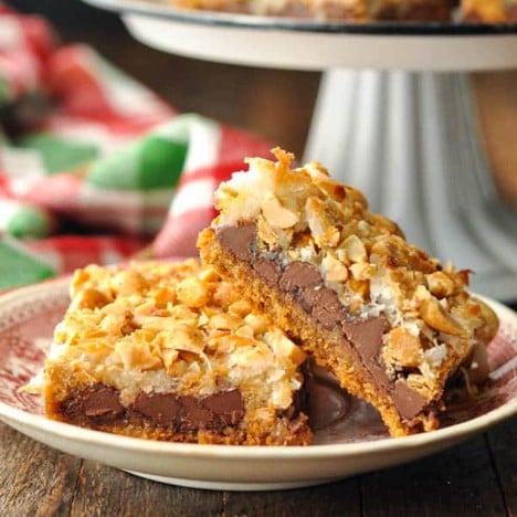 Square side shot of magic cookie bars on a plate