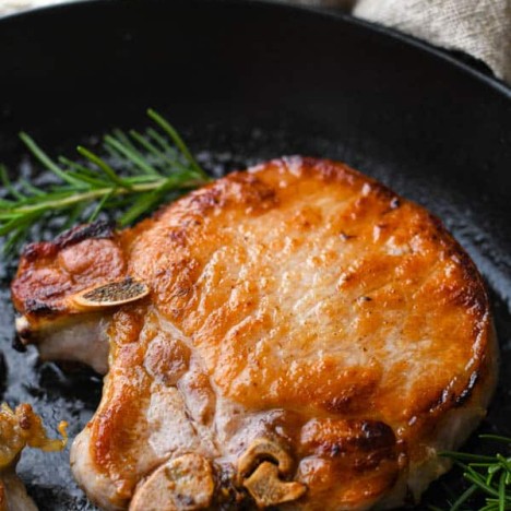 Easy pork chop brine used on thick pork chops and cooked in a cast iron skillet