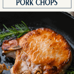 Rosemary pork chops in a cast iron skillet with text title box at top