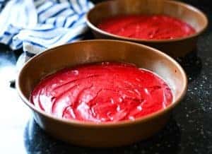 Process shot showing how to make red velvet cake from scratch