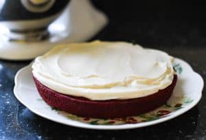 Process shot showing how to make red velvet cake frosting