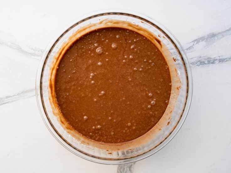 Batter for Texas sheet cake in a glass bowl.
