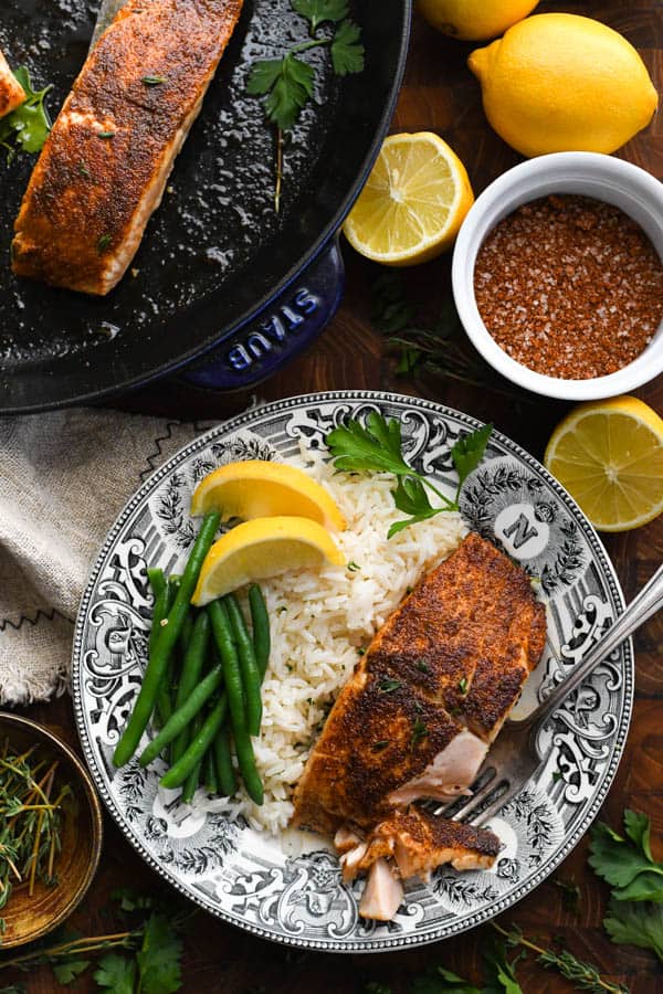 Overhead shot of a plate of healthy blackened salmon with a side of rice
