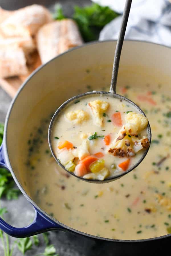 Ladle full of cheesy cauliflower soup