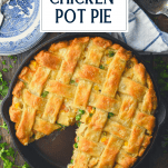 Overhead image of chicken pot pie in a cast iron skillet with text title overlay