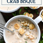 Overhead shot of a bowl of easy crab bisque with text title box at top