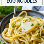 Close up side shot of homemade egg noodles side dish with text title box at top